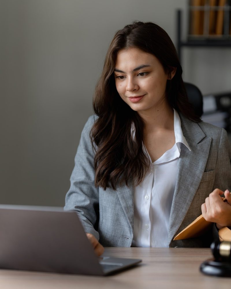 lawyer-business-woman-working-or-reading-agreement-contract-in-office-workplace-for-consultant.jpg